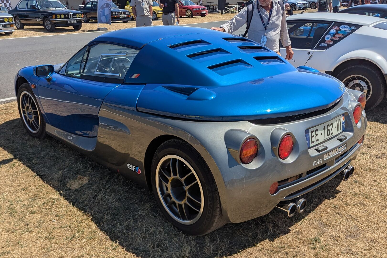 Blue and silver Renault Sport Spider with a hard top at Le Mans Classic Legend.