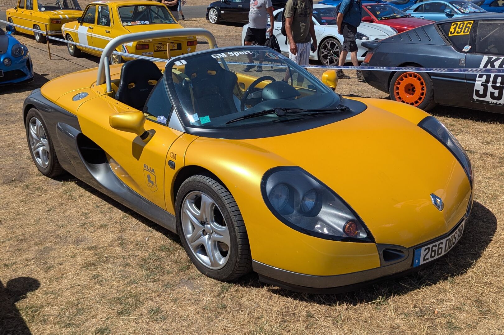 Yellow and silver Renault Sport Spider at Le Mans Classic Legend.