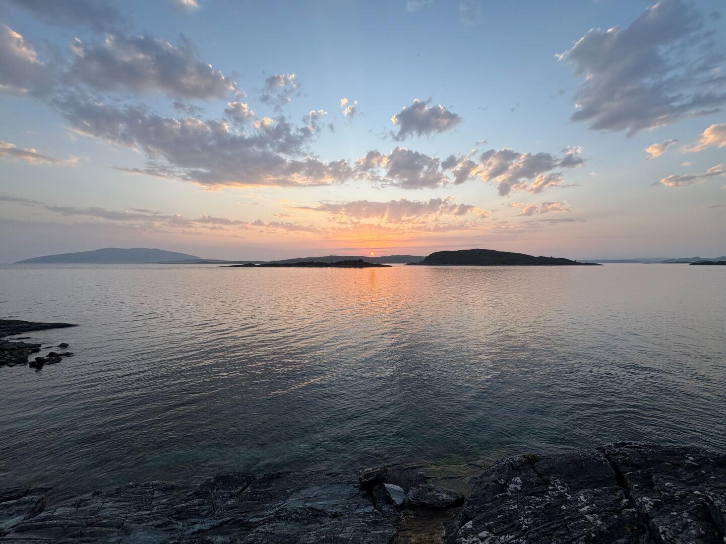Sun setting behind some islands