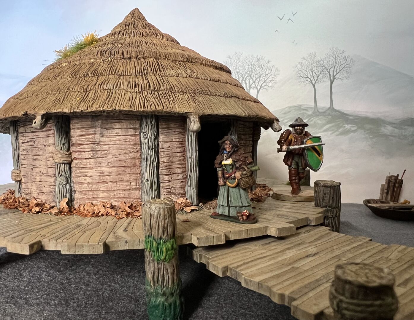 A view of a crannog (ancient round house built on a wooden platform over a lake), seen from the access pier.