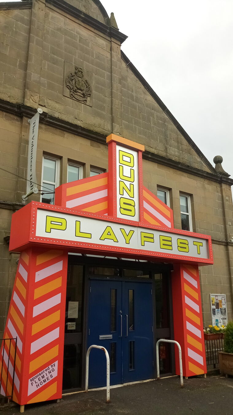 Late Victorian stone civic building with a Red and white timber entrance including our name in lights!