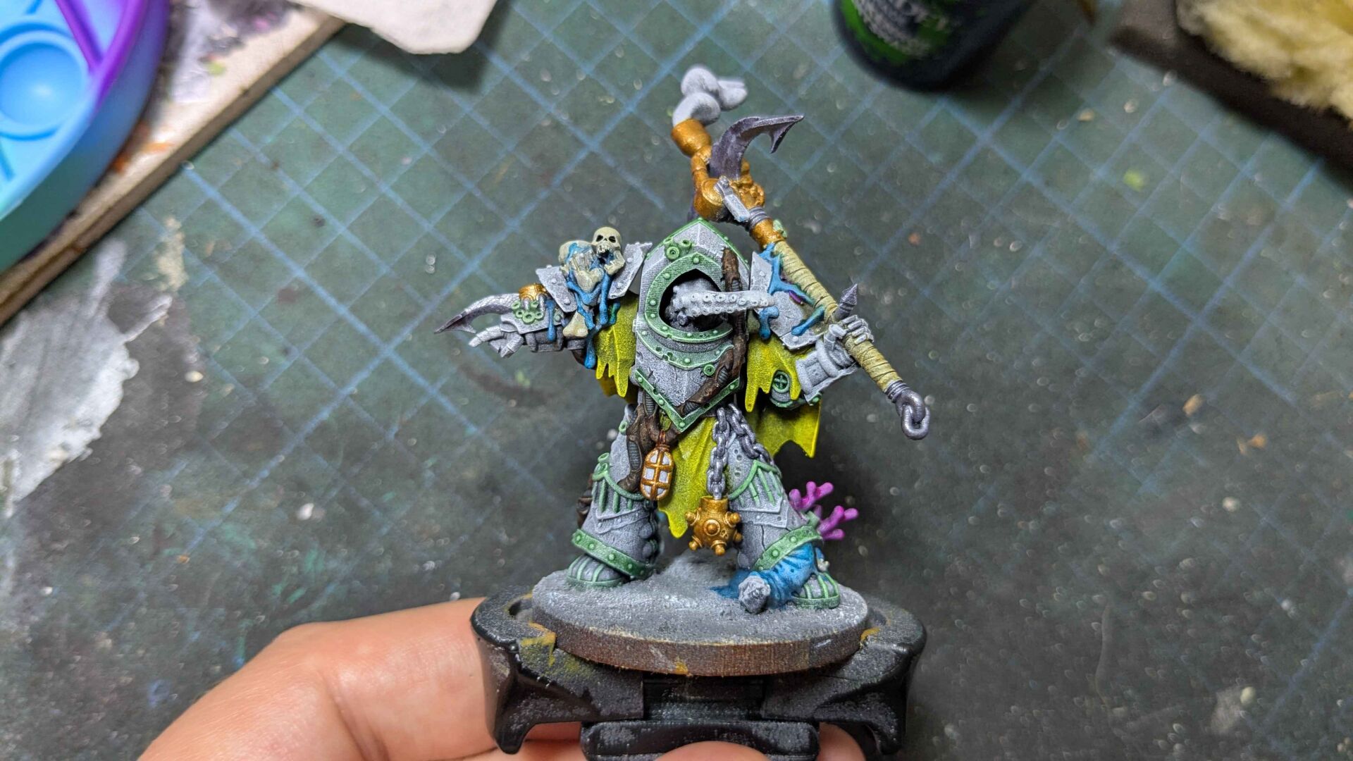 One of the three halfway through painting. Many of the colours have been picked out but without the washes that come later the colours look quite flat and unshaded. By comparison the finished miniatures have considerable depth to their paintjobs.